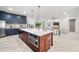 Open concept showcasing kitchen with center island and breakfast bar, flowing to the living area at 1802 E Park Cir, Tampa, FL 33610