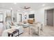 Bright living room featuring a modern ceiling fan, comfortable seating, and stylish decor at 1802 E Park Cir, Tampa, FL 33610