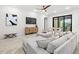 Bright living room with modern furniture, stylish decor, and herringbone floors at 1802 E Park Cir, Tampa, FL 33610
