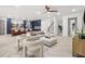 Expansive living area with open layout, showcasing kitchen island, modern furnishings, and hardwood floors at 1802 E Park Cir, Tampa, FL 33610