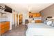 Cozy bedroom features kitchenette, tiled floors, ceiling fan and view into adjacent bathroom at 1849 Abrico Dr # 4, Lutz, FL 33558