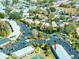 Overhead view of a condo complex with ample parking, green spaces, and mature trees in a well-maintained community at 1849 Abrico Dr # 4, Lutz, FL 33558