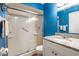 Bright bathroom features a granite-topped vanity and a shower with sliding glass doors at 1849 Abrico Dr # 4, Lutz, FL 33558