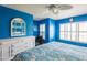 Bright bedroom with a white dresser, a ceiling fan, and plantation shutters at 1849 Abrico Dr # 4, Lutz, FL 33558