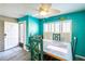 Cozy dining area with a rustic wooden table and turquoise accents, illuminated by a ceiling fan at 1849 Abrico Dr # 4, Lutz, FL 33558