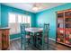 Cozy dining room with colorful furniture, large window with shutters, and a bright atmosphere at 1849 Abrico Dr # 4, Lutz, FL 33558