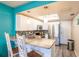 Well-lit kitchen featuring modern stainless steel appliances, granite countertops, and stylish backsplash at 1849 Abrico Dr # 4, Lutz, FL 33558