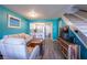 The open-concept living space shows seating, television, stairs and an eat-in kitchen at 1849 Abrico Dr # 4, Lutz, FL 33558