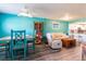 Bright living room with an open floor plan, dining area, and a kitchen bar with white cabinets at 1849 Abrico Dr # 4, Lutz, FL 33558
