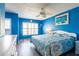 Comfortable main bedroom with a queen-size bed, shuttered windows, and blue walls at 1849 Abrico Dr # 4, Lutz, FL 33558