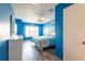 Bright main bedroom featuring blue walls, shuttered windows, and a patterned comforter on the bed at 1849 Abrico Dr # 4, Lutz, FL 33558