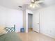 A cozy bedroom features a twin bed and a ceiling fan at 29523 Waggle Dr, San Antonio, FL 33576