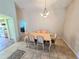 Bright dining area with a table, seating for six, and easy access to the kitchen at 29523 Waggle Dr, San Antonio, FL 33576