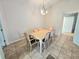 Traditional dining room with a table, six chairs, and tile flooring at 29523 Waggle Dr, San Antonio, FL 33576