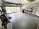 Large garage with insulated garage door and sealed floor provides great space for parking and storage at 29523 Waggle Dr, San Antonio, FL 33576