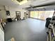 Insulated garage door, sealed floor and storage shelves highlight this garage space perfect for parking and hobbies at 29523 Waggle Dr, San Antonio, FL 33576
