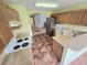 Functional kitchen with stainless steel appliances, tiled floors, and ample counter space at 29523 Waggle Dr, San Antonio, FL 33576