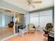 A screened-in porch offers seating and views of the backyard at 29523 Waggle Dr, San Antonio, FL 33576