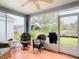 A screened-in porch offers seating, BBQ and views of the backyard pond at 29523 Waggle Dr, San Antonio, FL 33576
