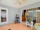 A screened-in porch offers seating and access to the backyard at 29523 Waggle Dr, San Antonio, FL 33576