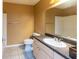 Bathroom with a white single sink vanity and shower at 3673 Kings Rd # 102, Palm Harbor, FL 34685