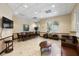 Spacious clubhouse interior featuring a dining table, comfortable seating, and a bright, inviting atmosphere at 3673 Kings Rd # 102, Palm Harbor, FL 34685
