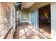 Enclosed porch with tile floors and sliding glass doors to the living room at 3673 Kings Rd # 102, Palm Harbor, FL 34685