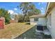 The backyard features an air conditioning unit and a partial view of the house at 4101 W Leila Ave, Tampa, FL 33616