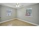 Bedroom featuring neutral walls, tile floors, ceiling fan and a bright window at 4101 W Leila Ave, Tampa, FL 33616