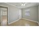 Bedroom featuring neutral walls, tile floors, and view of a closet and doorway at 4101 W Leila Ave, Tampa, FL 33616
