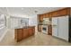 Traditional kitchen with stainless steel appliances, an island with granite countertop, and tile flooring at 4101 W Leila Ave, Tampa, FL 33616