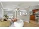 Open-concept living room connected to the kitchen, featuring comfortable seating and neutral tones at 4101 W Leila Ave, Tampa, FL 33616