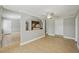 Open-concept living room featuring neutral tones, tile flooring, and lots of natural light at 4101 W Leila Ave, Tampa, FL 33616