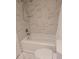 Clean bathroom with a shower-tub and white marble-patterned tile at 4915 Bay Ne St # 322, St Petersburg, FL 33703