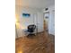 Bright bedroom features hardwood floors and a white writing desk at 4915 Bay Ne St # 322, St Petersburg, FL 33703