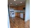 Well-maintained kitchen with wood cabinetry, white appliances, and ample counter space at 4915 Bay Ne St # 322, St Petersburg, FL 33703