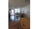 This living and dining area features laminate floors, a ceiling fan, and neutral decor at 4915 Bay Ne St # 322, St Petersburg, FL 33703