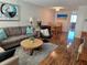 Inviting living room with comfortable seating, stylish decor, and an open layout to the dining area at 4915 Bay Ne St # 322, St Petersburg, FL 33703