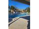 Community pool with lounge chairs offers a refreshing escape in a bright and sunny setting with palms at 4915 Bay Ne St # 322, St Petersburg, FL 33703