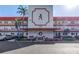 Charming condo building featuring well-maintained landscaping and a red-and-white design, creating a welcoming curb appeal at 5840 30Th S Ave # 208, Gulfport, FL 33707