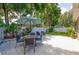 Well-maintained backyard with patio furniture and landscaping at 12261 Eldon Dr, Largo, FL 33774