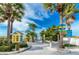 Scenic beach access path with tropical palm trees and blue skies at 12261 Eldon Dr, Largo, FL 33774