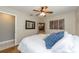 Cozy bedroom featuring a wood-look floor, soft lighting, and soothing decor at 12261 Eldon Dr, Largo, FL 33774