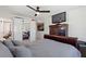 Cozy bedroom featuring a sleek dresser, a ceiling fan, and sliding mirrored closet doors at 4400 37Th S St # 3, St Petersburg, FL 33711
