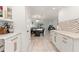 Modern kitchen view showcasing marble countertops, white cabinets, and stainless steel appliances at 4400 37Th S St # 3, St Petersburg, FL 33711