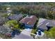 A well-maintained home with a large driveway, attached garage and beautiful lawn with mature trees at 8205 Prairie Ridge Way, Tampa, FL 33647