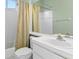 Clean bathroom featuring a sink, toilet, mirror, and shower, providing essential amenities at 8205 Prairie Ridge Way, Tampa, FL 33647