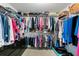 A walk-in closet featuring wire shelving and custom closet organizers with lots of hanging storage at 8205 Prairie Ridge Way, Tampa, FL 33647