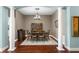 Traditional dining room with hardwood floors, neutral paint, chandelier and classic furniture at 8205 Prairie Ridge Way, Tampa, FL 33647