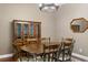 Charming dining room featuring wooden furniture, chandelier lighting, and hardwood floors for Gathering gatherings at 8205 Prairie Ridge Way, Tampa, FL 33647